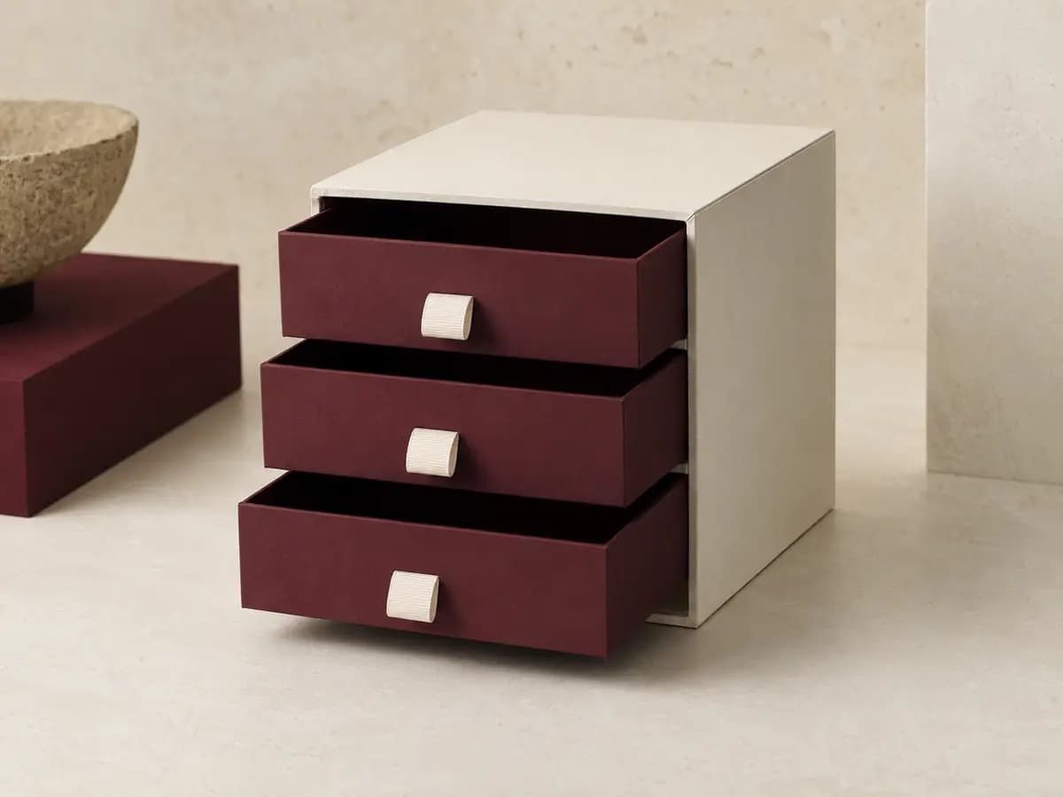 Ivory and burgundy multi-tier rigid drawer box with three ribbon-pull drawers